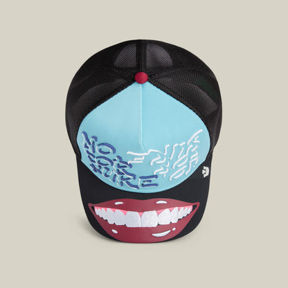 The "Means Understood" hat by Goorin Bros. is a black and light blue mesh cap with embroidered text, a brain graphic on the front, and a large illustration of smiling lips on the brim.