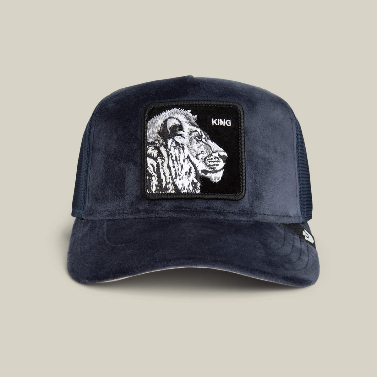 The Goorin Bros. Velour Lion hat in EDGE is a luxury cap with a mesh back, velour lion head, and KING patch on the front.