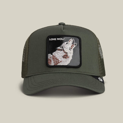 The Lone Wolf Trucker by Goorin Bros. in PALM channels outlaw style with mesh sides, a front patch of a howling wolf, and bold LONE WOLF text.
