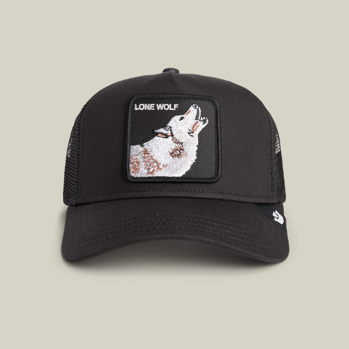 The Goorin Bros. Lone Wolf Trucker in VOID features black mesh and a front patch with a howling wolf and “LONE WOLF”—ideal for true outlaw energy.