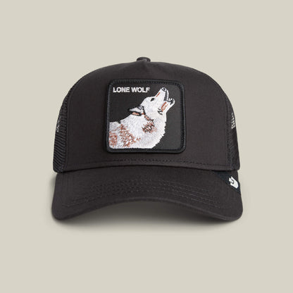 The Goorin Bros. Lone Wolf Trucker in VOID features black mesh and a front patch with a howling wolf and “LONE WOLF”—ideal for true outlaw energy.