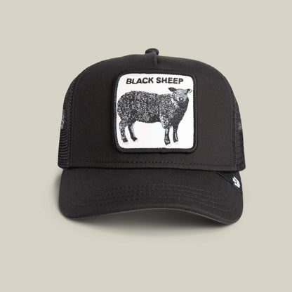 The Goorin Bros. Black Sheep Trucker in VOID features a front patch with a black sheep and "BLACK SHEEP" text—ideal for anyone bold enough to stand out.