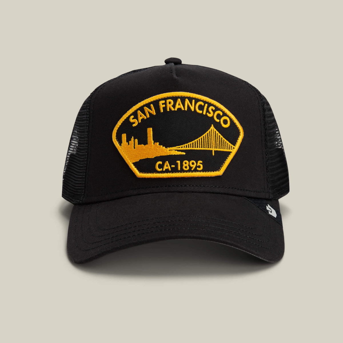 The Goorin Bros. San Francisco hat in VOID features a yellow patch reading "San Francisco CA-1895" with a skyline and bridge design on the front.