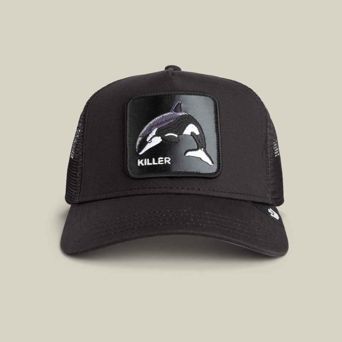 The Killer Trucker by Goorin Bros. is a black and white mesh cap with an apex-stitched orca patch and the word "KILLER" on the front.