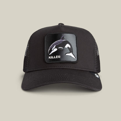 The Killer Trucker by Goorin Bros. is a black and white mesh cap with an apex-stitched orca patch and the word "KILLER" on the front.