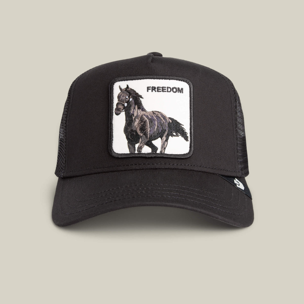 The Goorin Bros. Freedom Horse hat is a black mesh trucker cap with an embroidered black horse and "FREEDOM" patch on the front—ideal for expressing your wild spirit on the open road.