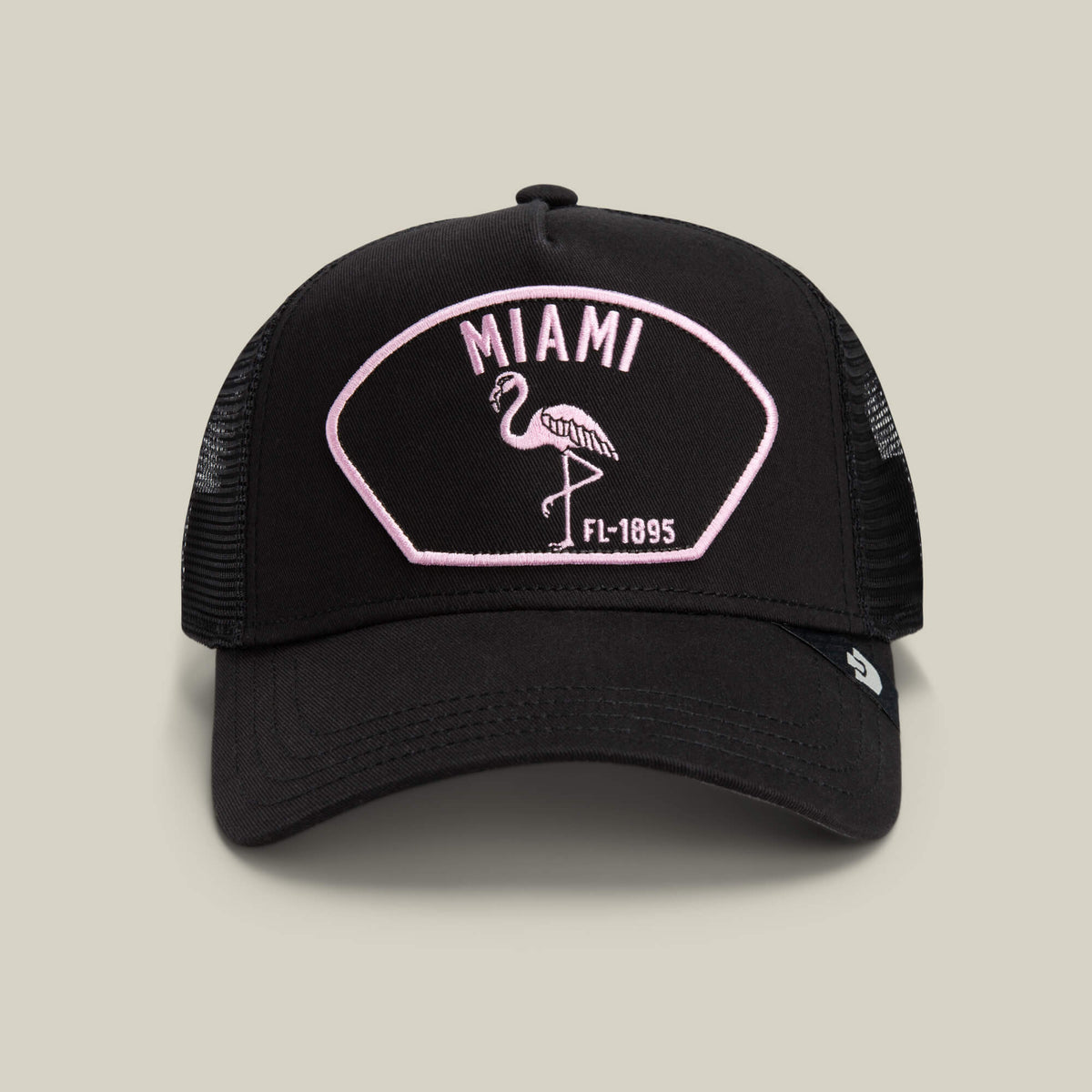 Show off your South Beach style with the VOID-colored "Miami" mesh cap by Goorin Bros., featuring a pink and white patch with a flamingo and FL-1895 text on the front.