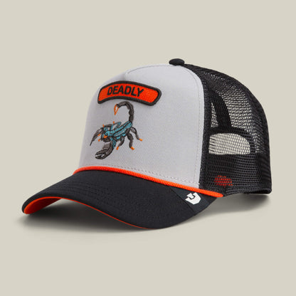 The Goorin Bros. Pop Rocker Scorpion is a gray and black mesh back cap with an embroidered scorpion and DEADLY patch on the front, orange accents, and a curved brim.