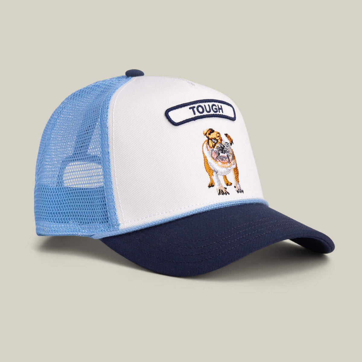 The Goorin Bros. Pop Rocker Bulldog is a blue and white navy mesh trucker hat with a mesh back, featuring an embroidered bulldog and the word "TOUGH" on the front.