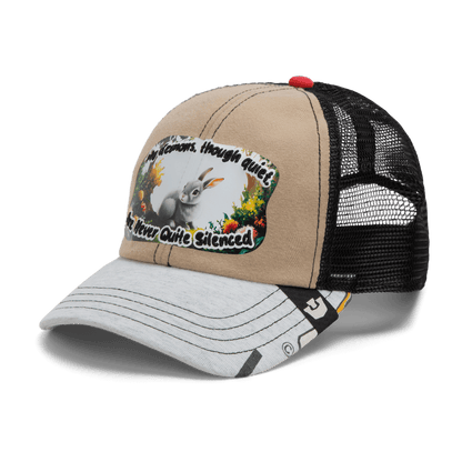 The Lil Ronin by Goorin Bros. is a beige and black mesh trucker hat with a rabbit and flowers patch. "The Flowers, though quiet, Are Never Quite Silenced" text accents this unique design from recycled tees.