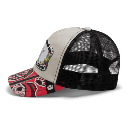 The Lil Ronin trucker by Goorin Bros. from our Storybook collection features a beige front, black mesh back, red patterned bill, and a bird-and-landscape patch—crafted in part from recycled tee shirts.