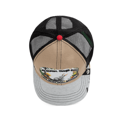 The Lil Ronin trucker hat from Goorin Bros.' Storybook collection features a tan and gray front, black mesh back, and a patch with text plus a graphic of a dog with flowers.