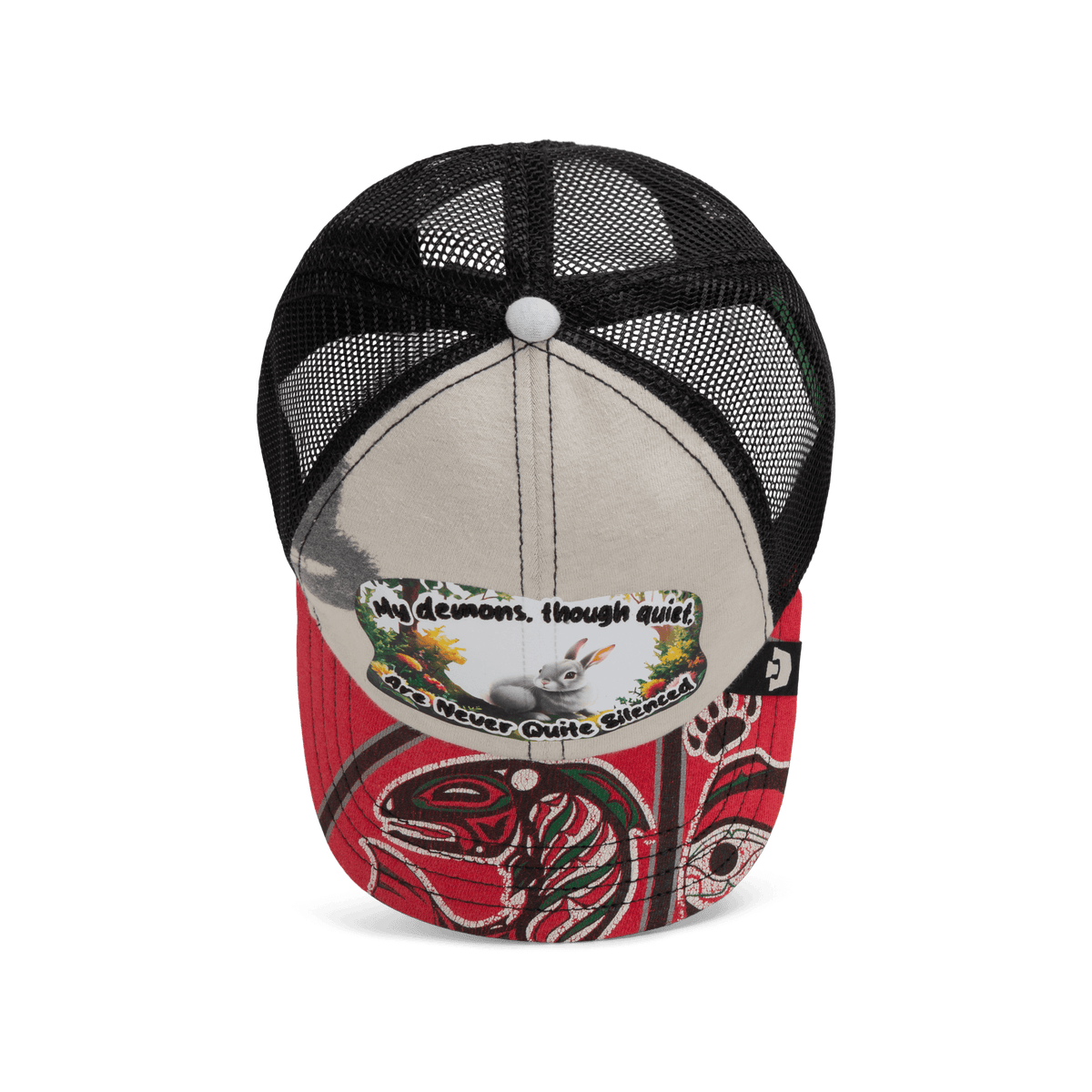 The Goorin Bros. Lil Ronin from the Storybook collection is a black mesh and beige trucker cap with a red brim, featuring Indigenous-style art and a patch that reads, "My demons, though quiet, are never quite silenced.