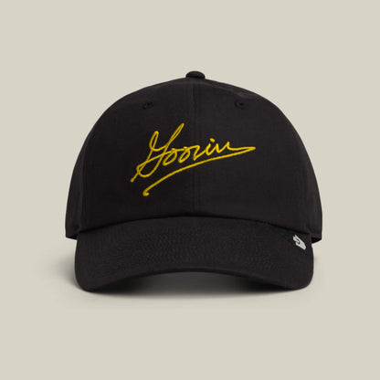 The Goorin Script Papa cap by Goorin Bros. comes in VOID, featuring “Yoonin” embroidered in yellow script on the front—a classic accessory with signature style.