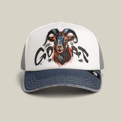 The Goat Disruption by Goorin Bros. is a digital-color trucker hat with a hand-drawn goat's head and GOAT in stylish black letters, made from recycled materials for eco-friendliness.