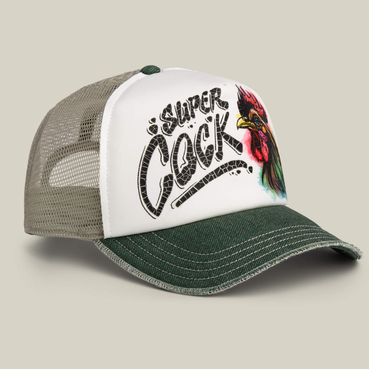 The Goorin Bros. Cock Disruption hat features a hand-illustrated rooster on a white front panel, bold text, green brim, and classic mesh trucker style for standout flair.