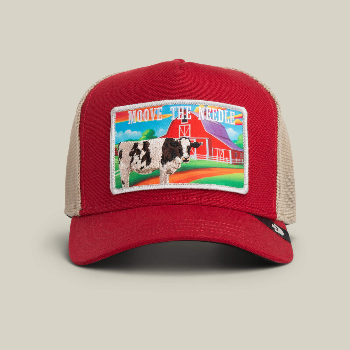 The Goorin Bros. Greener Grass - Moove the Needle trucker hat in RUSH features a colorful barn patch with a cow, mountains, and the phrase MOOVE THE NEEDLE.