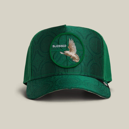 The Goorin Bros. Religulous - Blessed hat in ENVY features a textured pattern, a circular flying bird patch, and "BLESSED" embroidered above it on the front.