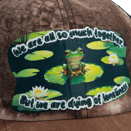 The Goorin Bros. Lil Sohei cap from our Storybook collection features a frog-on-lily pad patch and the phrase, "We are all so much together, but we are dying of loneliness." Discover hats that tell a story.