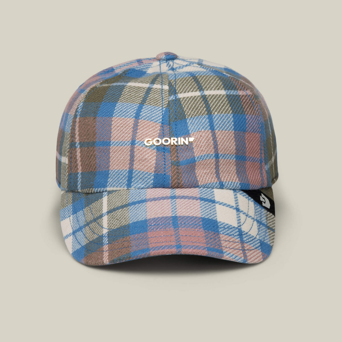 Front view of the Bespoke Wordmark V2 cap by Goorin Bros. in CRUISE—a plaid design with GOORIN text on the front and a black tag on the brim, perfect for casual style.