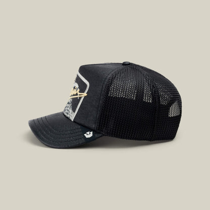 The NeoBrand GOAT by Goorin Bros. is a black mesh trucker hat with a curved bill, front patch, and side white logo tag—ideal to pair with your favorite monochrome kicks or GOAT gold script sneakers.