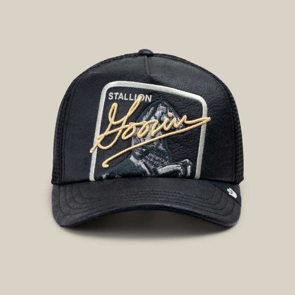 The Goorin Bros. NeoBrand STALLION is a black mesh trucker hat featuring a monochrome embroidered horse patch labeled "STALLION" and gold Goorin signature on the front.