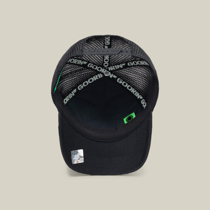 The NeoBrand STALLION by Goorin Bros. is a black mesh trucker hat featuring Goorin branding on the sweatband and a small STALLION label near the brim, with monochrome embroidery for a sleek look that pairs well with black sneakers.