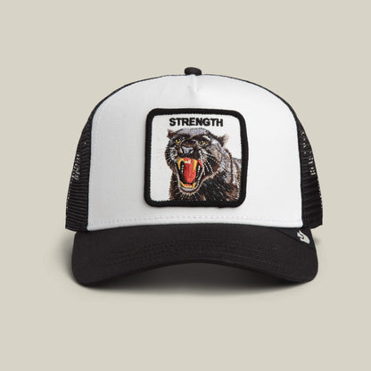 The Strength Panther Trucker by Goorin Bros. in DUST / VOID features a bold embroidered "STRENGTH" above a dynamic panther patch on this stylish black and white cap.