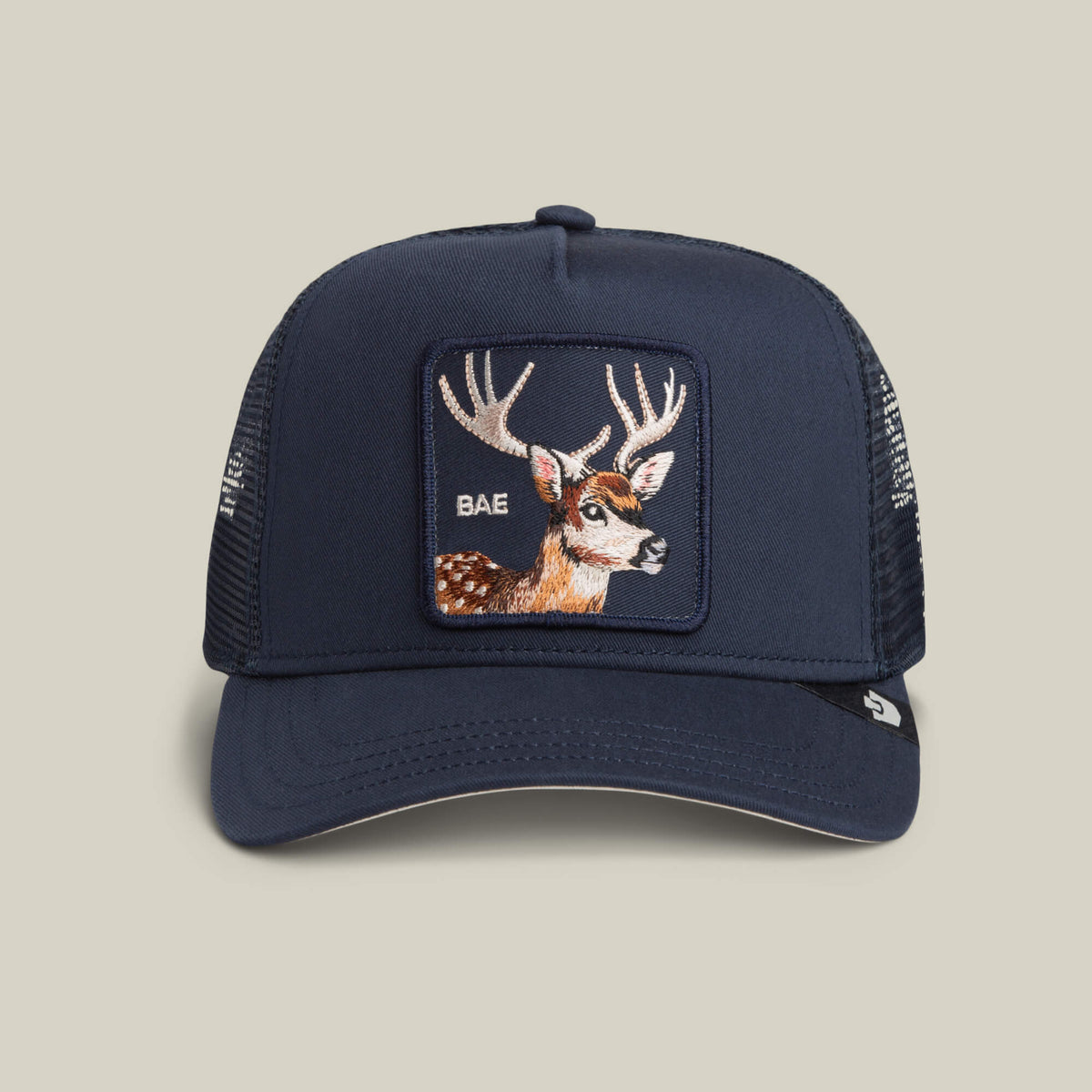 Add a playful vibe to your casual look with the Mirage Bae trucker hat by Goorin Bros. in EDGE, featuring a bold embroidered deer patch and “BAE” on the front.