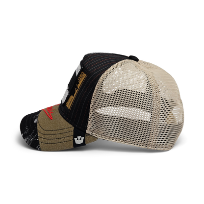 A side view of the limited edition Goorin Bros. Goorin Rework Trucker cap, featuring multicolored beige and black panels, a mesh back, a curved brim, and assorted patches on the front and side.