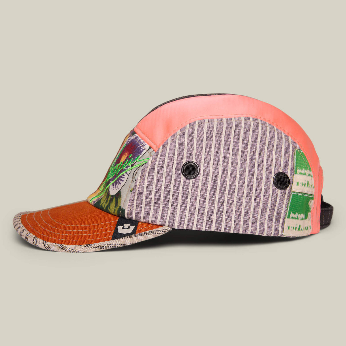The Goorin Rework Camper by Goorin Bros. is a limited edition, multicolored five-panel camp cap with striped, solid, and graphic recycled fabric panels, metal eyelets, an adjustable back strap, made in the USA and shown on a neutral background.