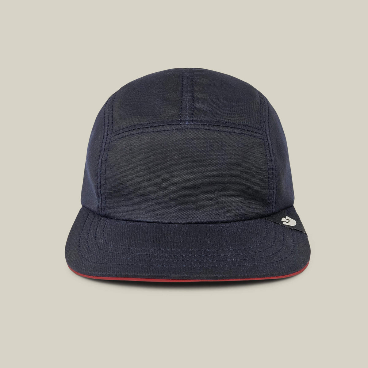 The North Boulder by Goorin Bros. is an Edge Navy 5-panel camp cap with visible stitching, a short brim, and a small right-side tag. Hand cut and sewn in the USA, it's shown on a plain beige background.