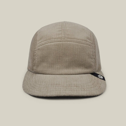The Goorin Bros. Meadow Creek is a Toast Tan cotton corduroy 5-panel camp cap with a short brim, front view, and a small black tag with white logo on the brim's side. Made in USA.