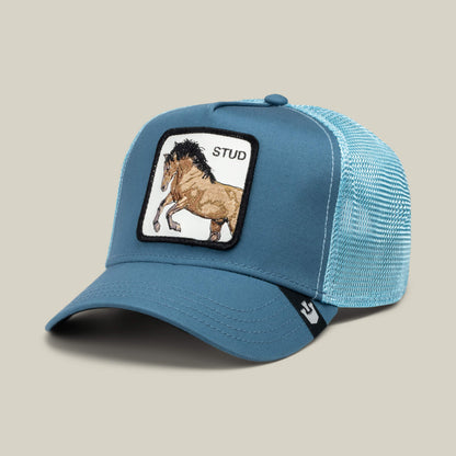 The Goorin Bros. "Dad and Pony Show (Adult)" is a blue mesh trucker hat featuring a front patch with a running horse and the word STUD.