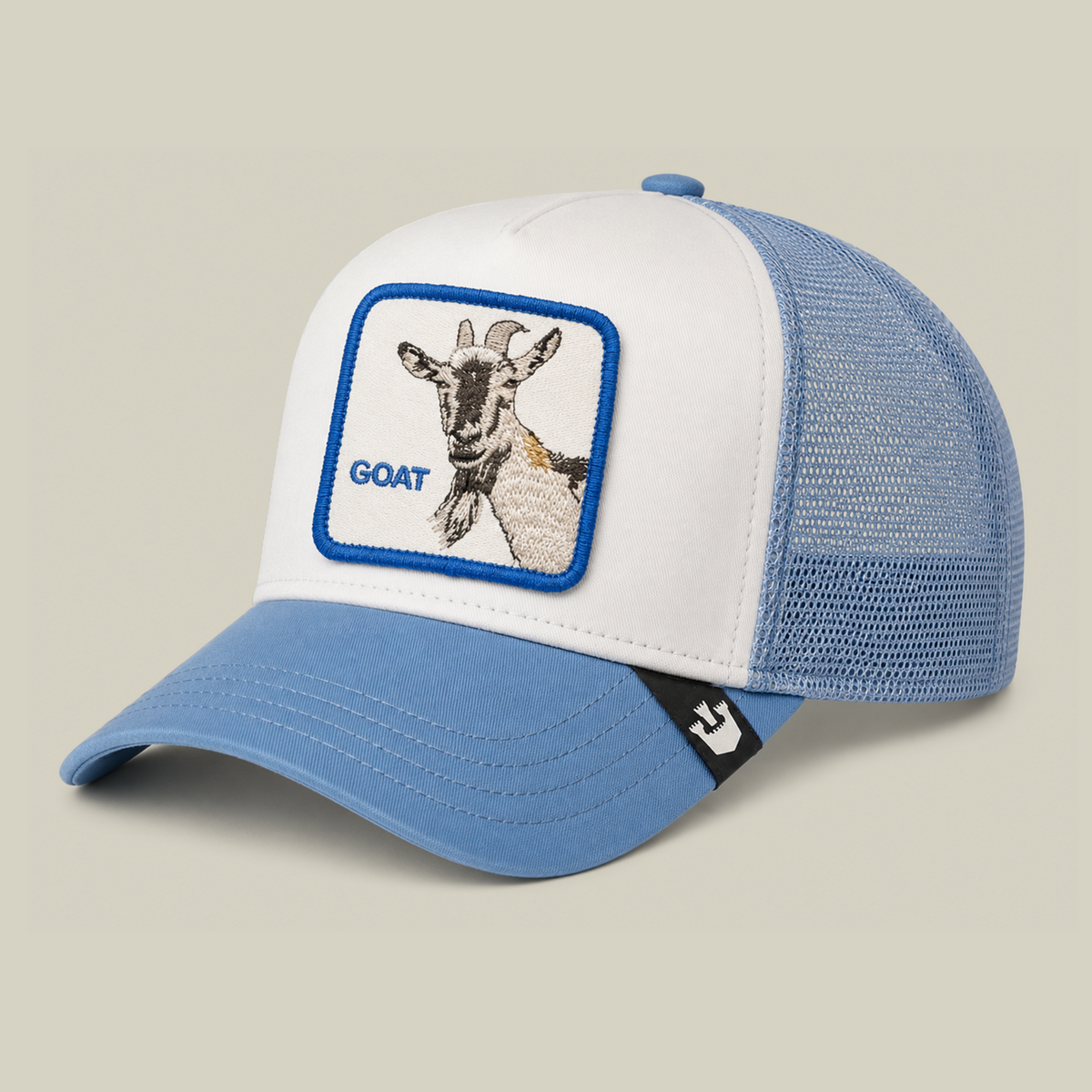 Blue and white mesh La Pulga Atomica trucker hat by Goorin Bros., featuring an embroidered patch with a goat graphic and bold lettering on the front.