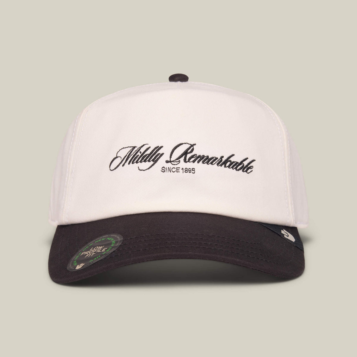 The Goorin Bros. Mildly Remarkable Script cap features classic script embroidery on the front in black, with a Low Pro Fit design in DUST/VOID colors.