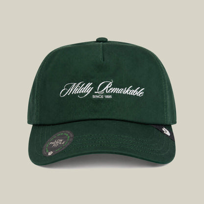 The Goorin Bros. Mildly Remarkable Script cap in GUARD features a Low Pro Fit, classic white script embroidery stating "Mildly Remarkable Since 1895" on the front, and a sticker on the brim.
