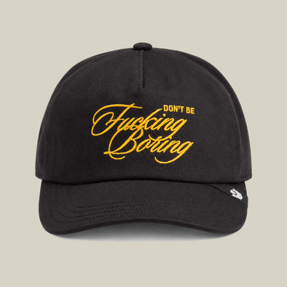 The Goorin Bros. "Don't Be Fucking Boring" hat in Void features gold script embroidery on the front.