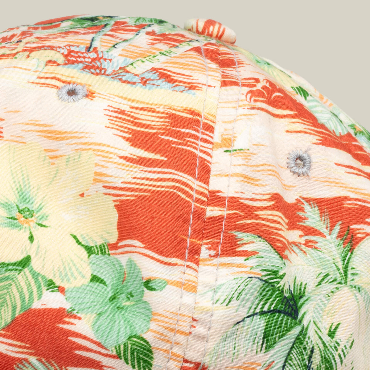 Close-up of a Goorin Bros. Funemployed Forever papa cap, showcasing a tropical floral pattern in orange, green, and yellow—a fresh Friday drop.