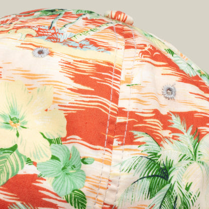 Close-up of a Goorin Bros. Funemployed Forever papa cap, showcasing a tropical floral pattern in orange, green, and yellow—a fresh Friday drop.