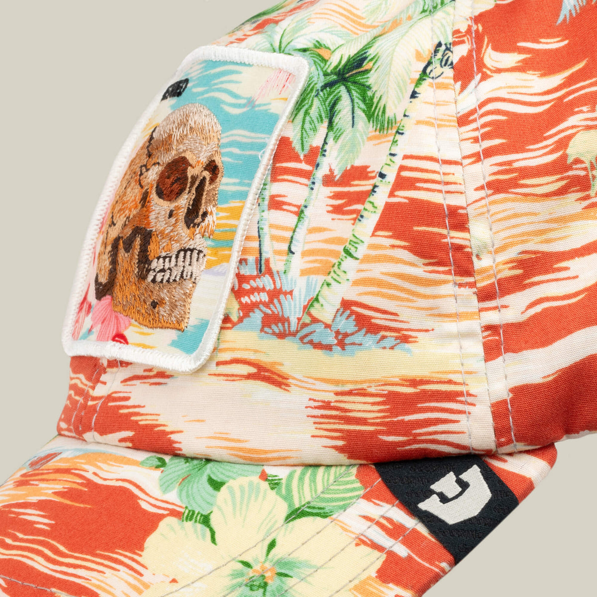 A close-up of the Goorin Bros. Funemployed Forever cap, boasting a tropical palm and wave pattern plus a fabric skull patch—ideal for rocking those funemployed forever vibes.