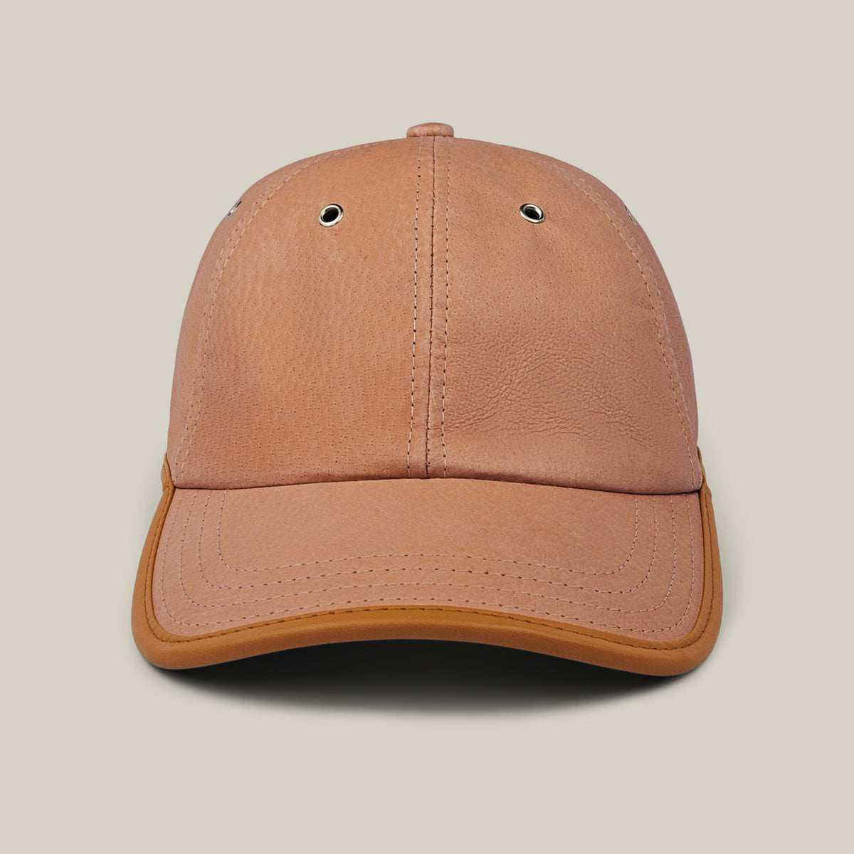Steiner cap by Goorin Bros. in Tile Brown suede, with two metal eyelets on the front panels and an adjustable plaid strap at the back, shown from the front against a plain light background.