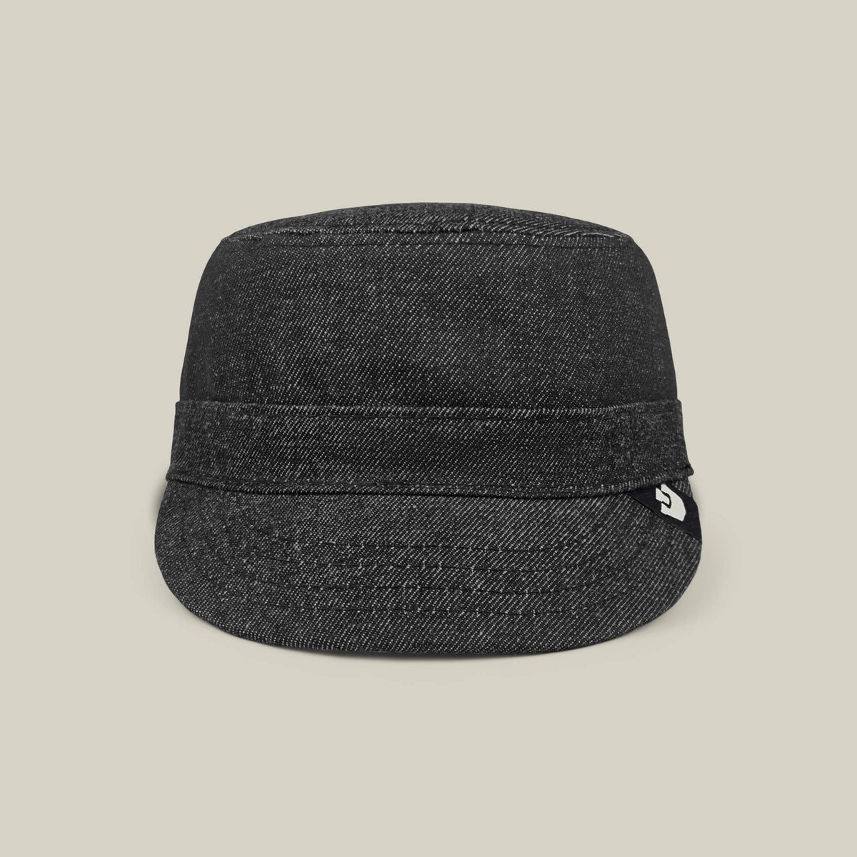 The Goorin Bros. Devonshire cap in black denim features a short brim and folded band, hand cut and sewn, displayed against a plain beige background.