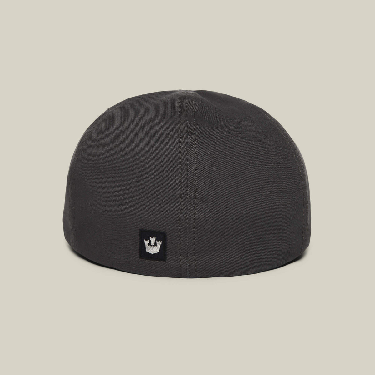 The Goorin Bros. Murray Way is a black beanie-style cap, shown from the back with a small rectangular patch featuring a white crown emblem near the bottom center, crafted from 100% cotton for comfort and quality.