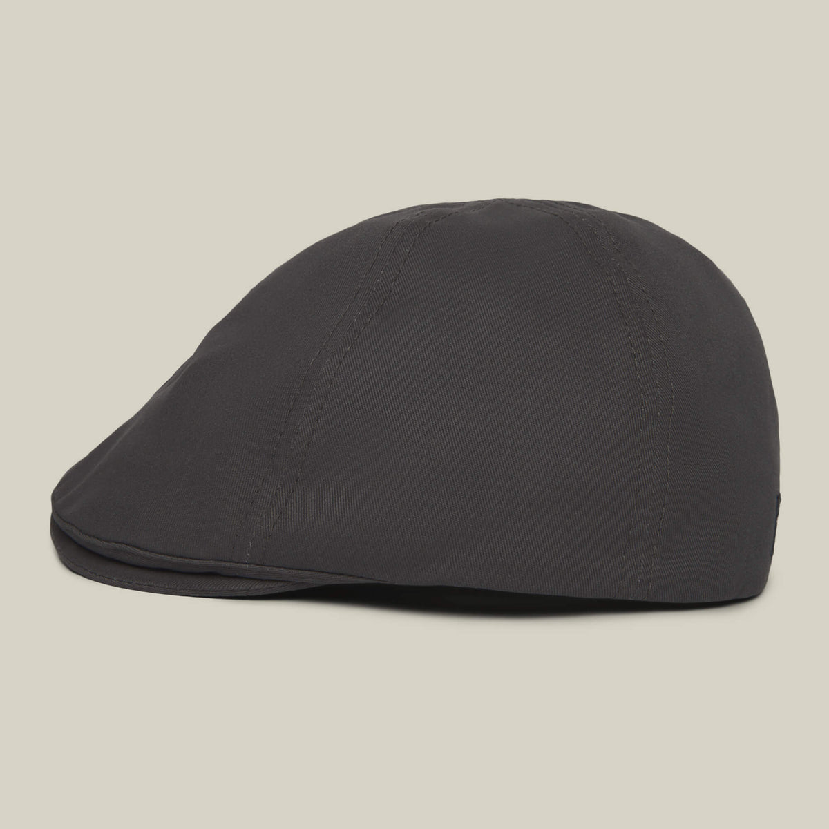 The Goorin Bros. Murray Way flatcap, made from 100% cotton in black, is displayed side-on against a plain beige background.