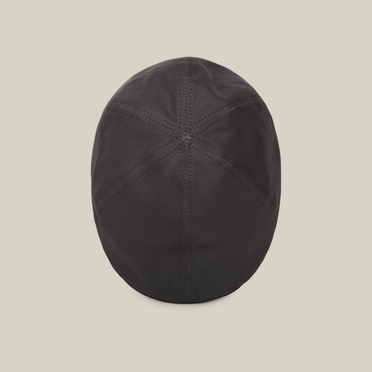 The Goorin Bros. Murray Way is a black 100% cotton flatcap, American made, shown from above with stitched panel seams on a plain light background.