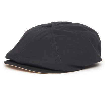 The Mulberry Street flatcap by Goorin Bros. is a trendy black cotton cap featuring a short, stiff brim and a round, panelled crown, displayed on a plain white background.