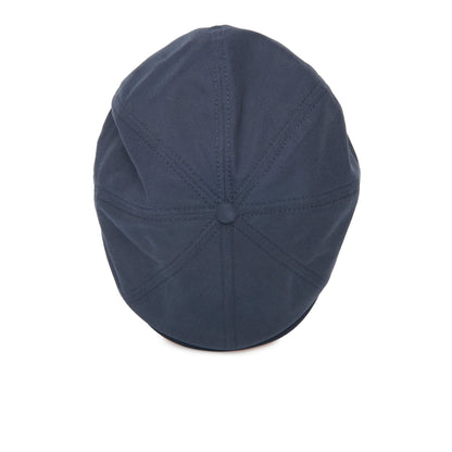 The Goorin Bros. Mulberry Street flatcap in navy blue is displayed from above on a white background, highlighting its stitched panels and central button.