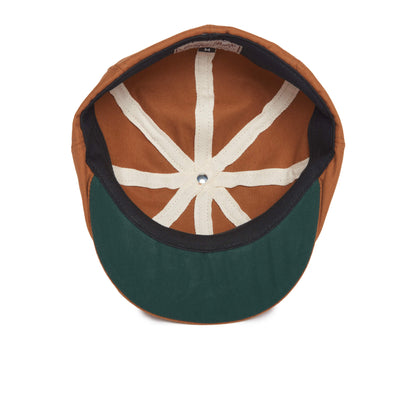 Brown baseball cap flipped upside down, showing the interior with white seams radiating from the top button and a dark green brim—a casual alternative to the classic Goorin Bros. Mulberry Street.