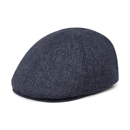 The Goorin Bros. Harry Bones is a dark blue wool flatcap with a herringbone pattern, displayed from a side angle on a plain white background.